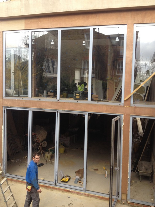 Aluminium bi-fold doors with two-storey glazing in Chessington