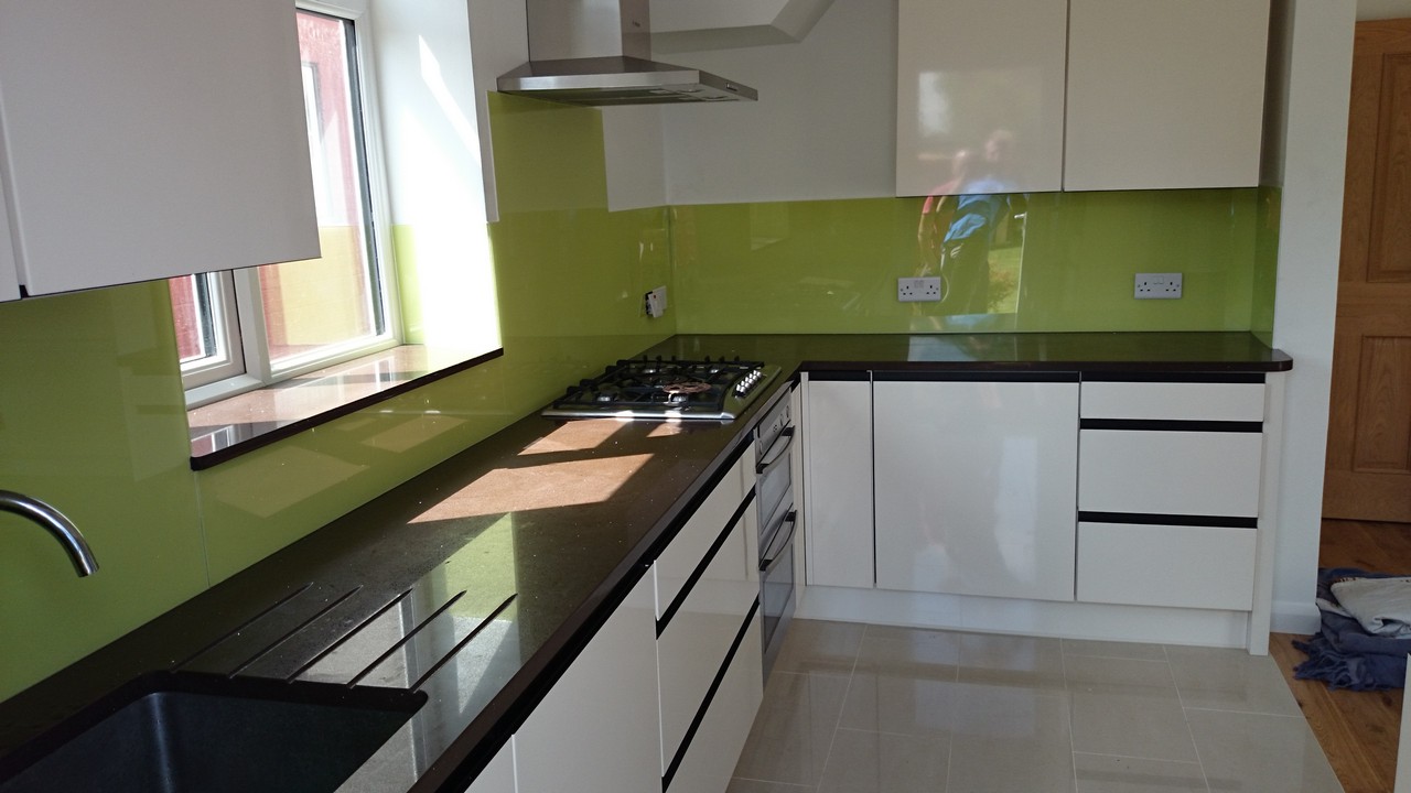 Lime green glass kitchen splashback installed by Chessington glaziers