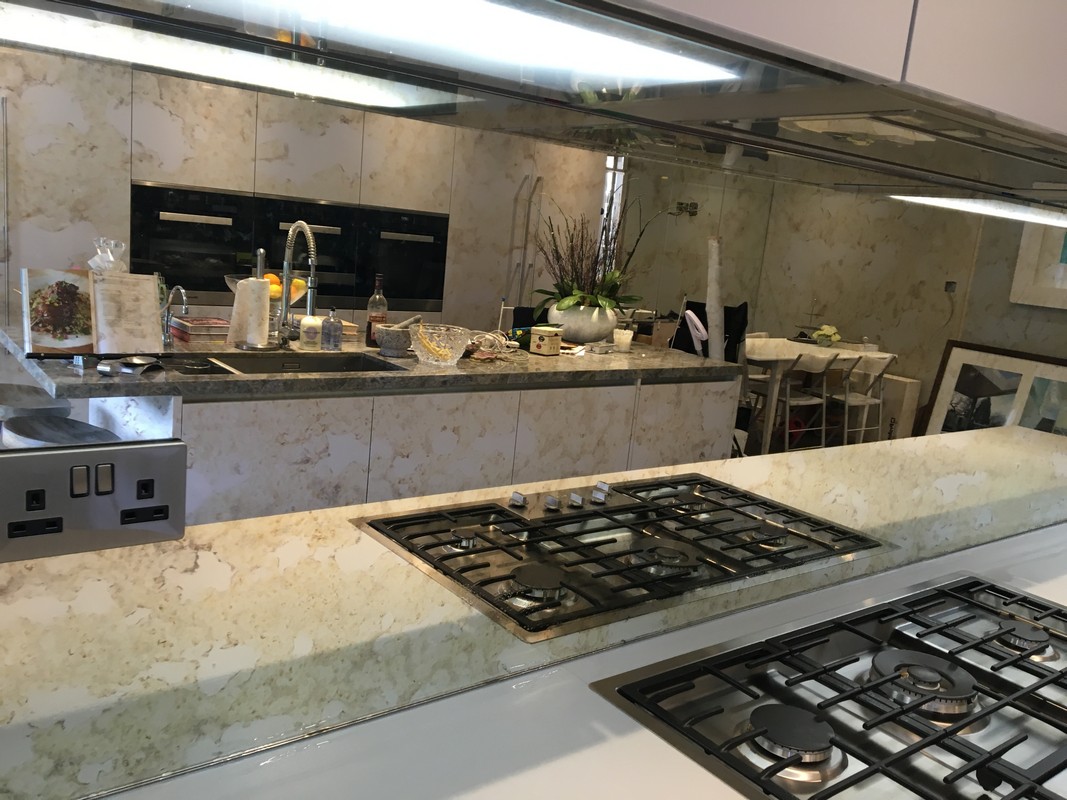 Mirror glass splashback in Chessington luxury kitchen