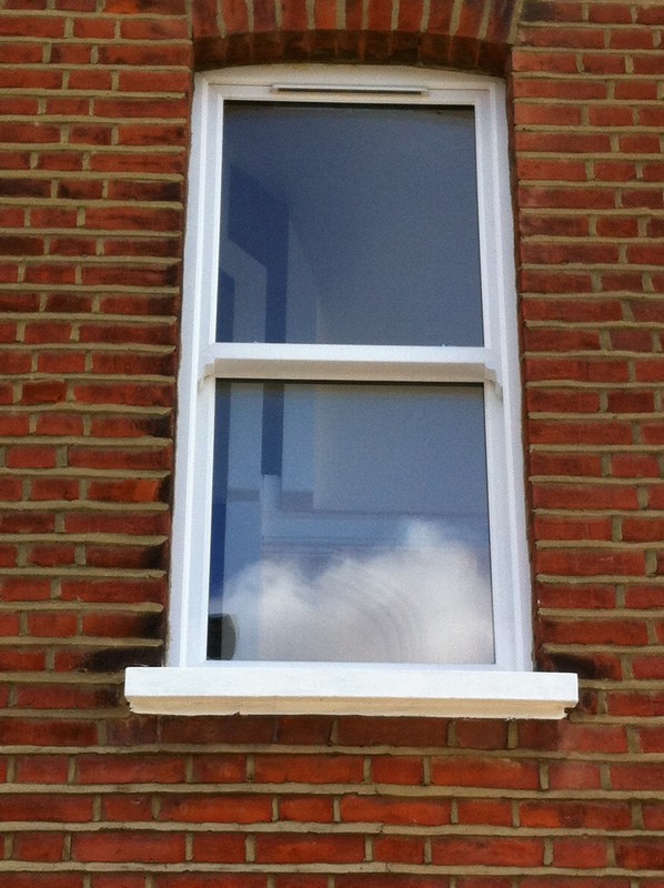 uPVC sash window on Victorian red brick house in Chessington
